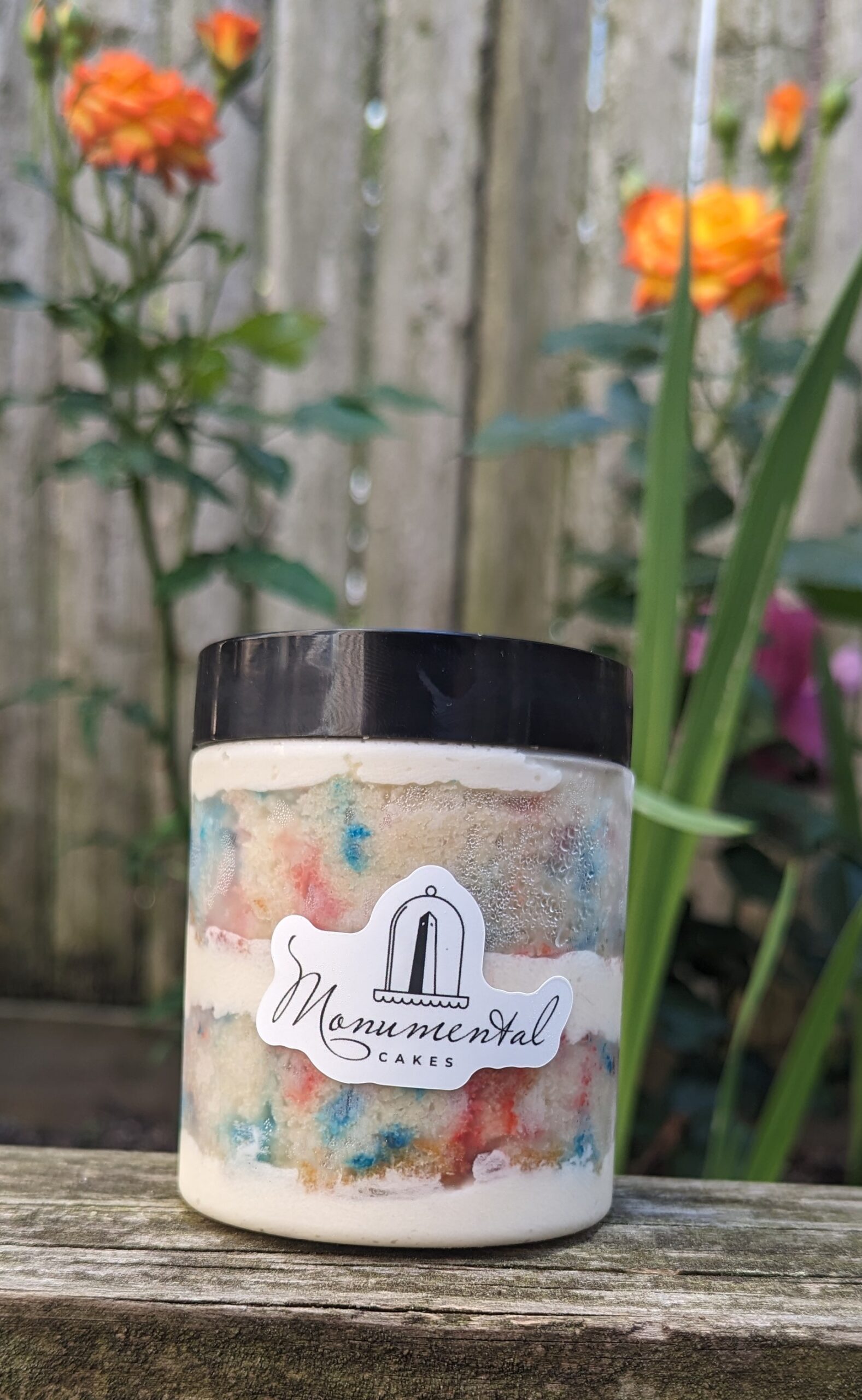 cake jar in front of flowers